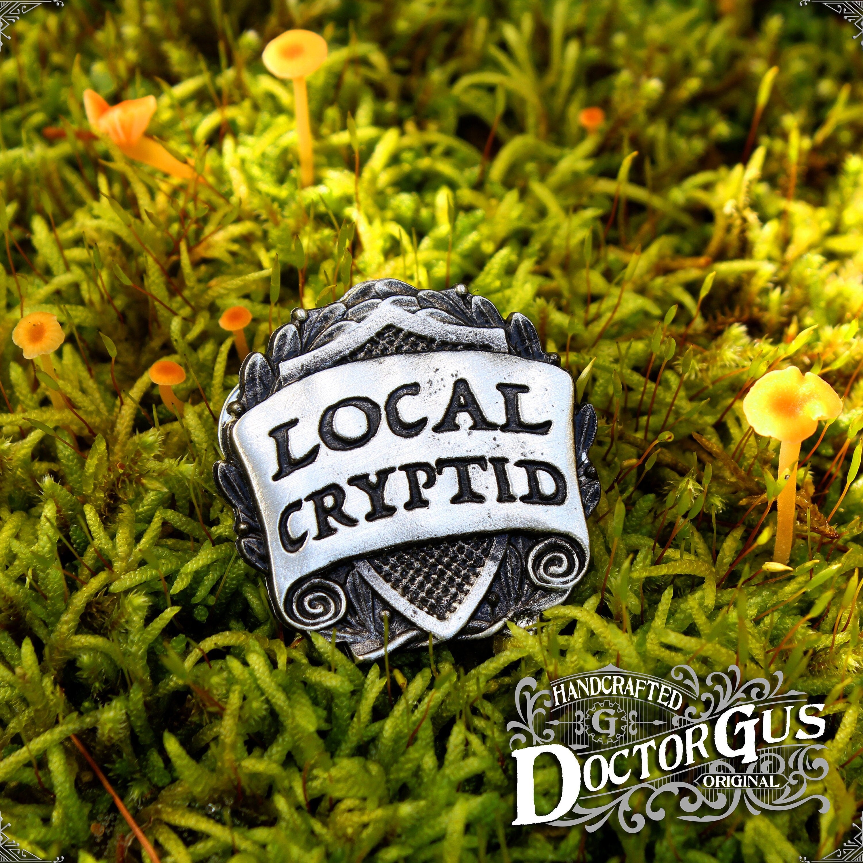 Local Cryptid Badge – Doctor Gus Designs